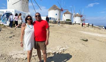 Couple with traditional windmills in the background.