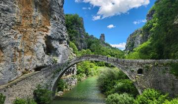 Beautiful stone bridge surrounded by a rugged landscape.