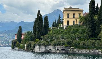 Luxurious lakeside villa with well-maintained gardens.