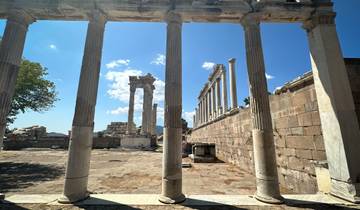 Ancient Greek ruins with stone columns.