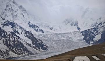 Majestic snowy mountain peaks and a glacier.