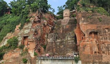 Leshan Giant Buddha carved into rock face.