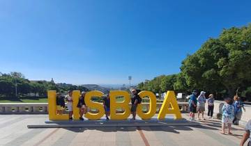 Large 'Lisboa' sign with cityscape in the background.