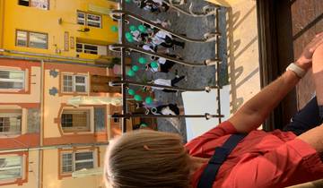 Person looking out of a window at a street parade