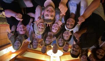 Group selfie with smiling faces indoors