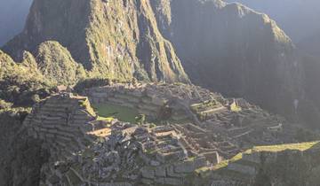 Aerial view of Machu Picchu with mountains in the background.