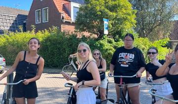 Group of friends on bicycles in a residential area.