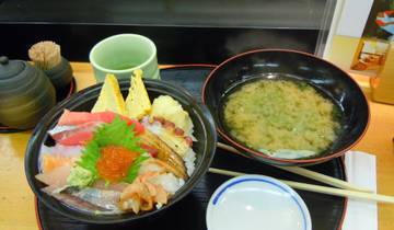 Japanese cuisine with sushi and miso soup served on a tray.