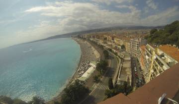 Panoramic view of a coastal city with a beach.