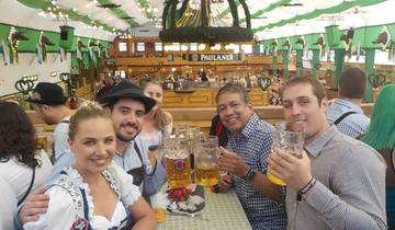Group of people enjoying drinks in a festive indoor setting.