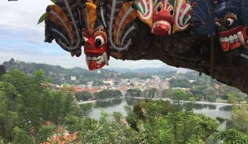 View of a city over a lake with traditional masks.