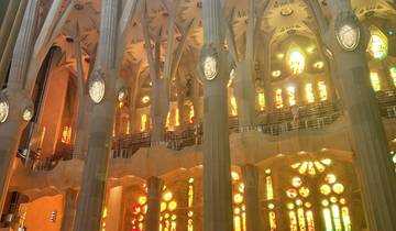 Interior view of La Sagrada Familia with stained glass.