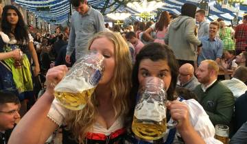 People enjoying beer at a festive event.