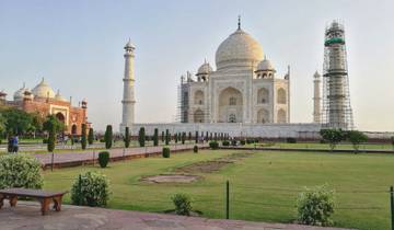 Taj Mahal with surrounding gardens and structures.