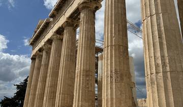 Columns of an ancient structure with blue sky.