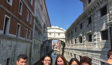 Group of people near the Bridge of Sighs in Venice.