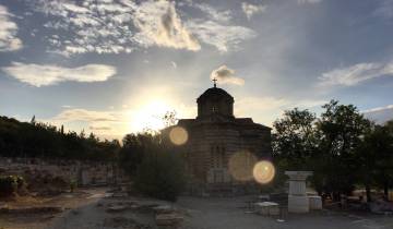 Silhouette of a church tower during sunset.