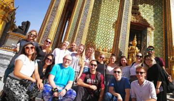 Large group in front of an ornate temple.
