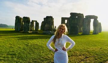 Person posing in front of Stonehenge.