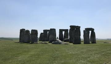 The iconic prehistoric monument, Stonehenge, under a clear sky.