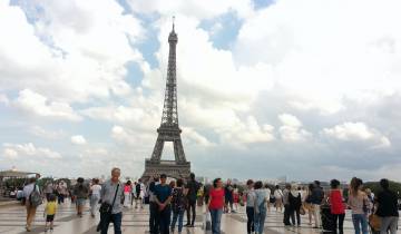 Crowds with a view of the Eiffel Tower in Paris.