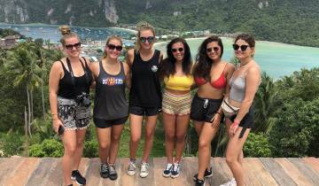 Group of friends with an ocean and island view.