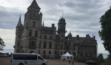 Historic castle against a cloudy sky.
