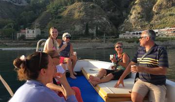 Group of people enjoying drinks on a boat.