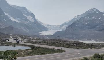 Glacier with a mountainous landscape in the background.