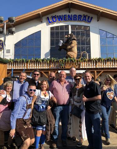Large group enjoying a festival in traditional clothing.