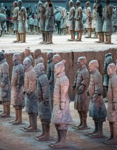 Terracotta warriors in an excavation site.