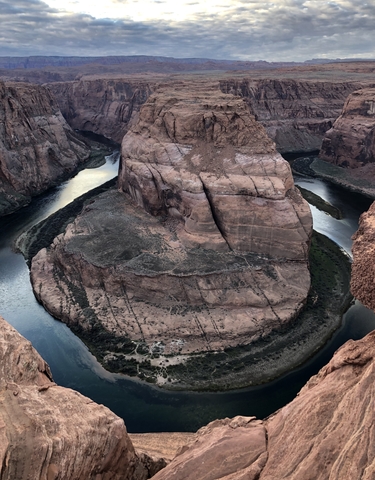 Horseshoe Bend with the Colorado River winding around rock formations.