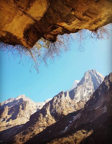 Mountain peaks against a clear blue sky.
