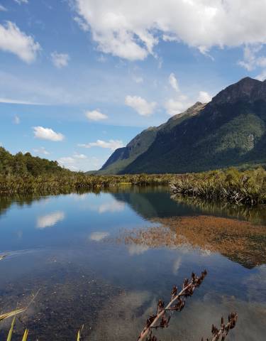 Scenic lake with mountains and reflective water