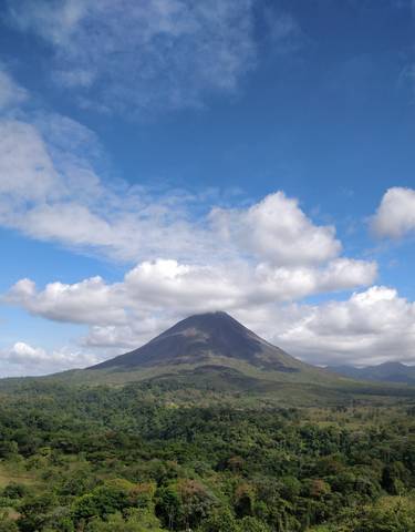 Arenal Volcano with clouds around the summit.