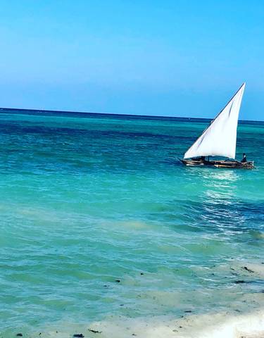 Sailing boat on turquoise sea