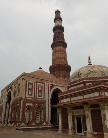 Ancient stone minaret and dome structures.