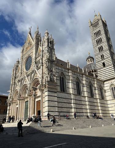 Cathedral facade with people around.