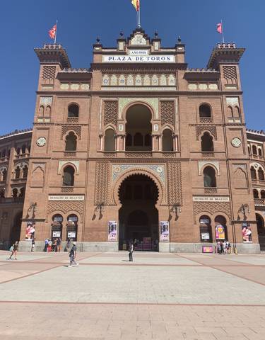 Historic bullring with intricate brickwork.