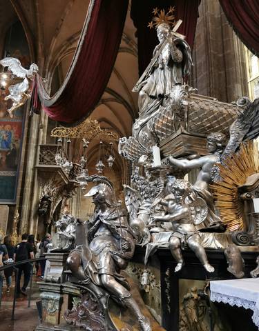 Ornate decorations inside a richly adorned church.