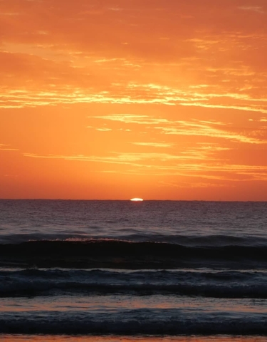 Sunset view over the ocean with colorful sky.