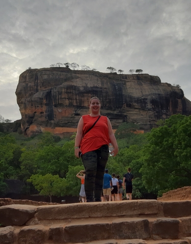 Person in front of the Sigiriya rock formation.