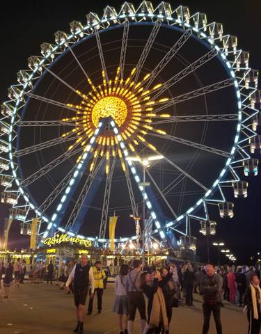 Illuminated Ferris wheel at night.