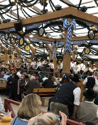 Dance performance at a festival with traditional Bavarian attire.
