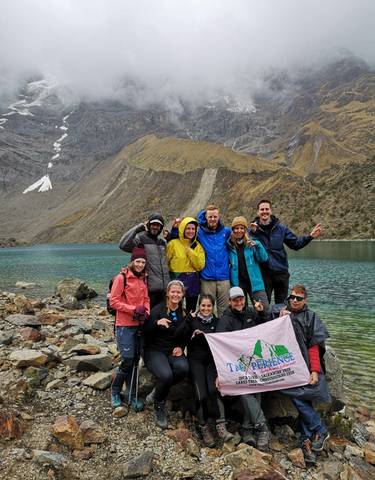 A group of hikers by a mountain lake.