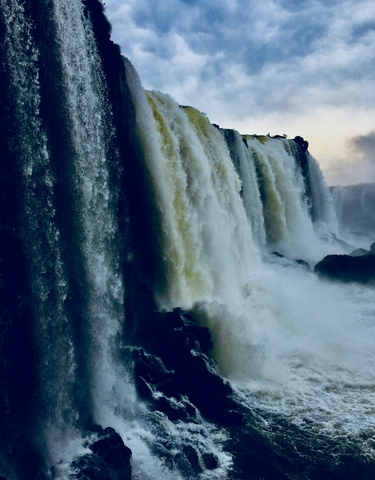 Close-up of water cascading down Iguazu Falls.