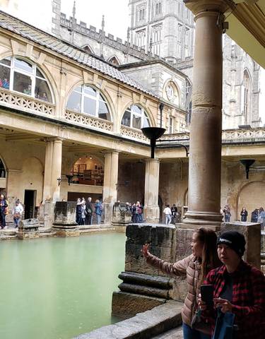 Tourists visiting the Roman Baths.