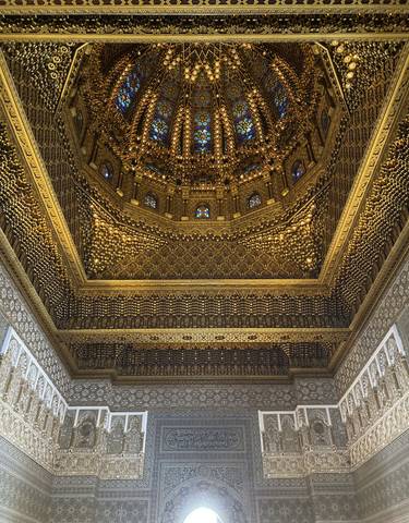 Elaborate golden ceiling with intricate designs.