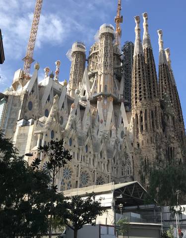 World-famous cathedral with elaborate facades under a clear sky.