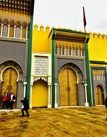 Intricately designed gates with golden doors.
